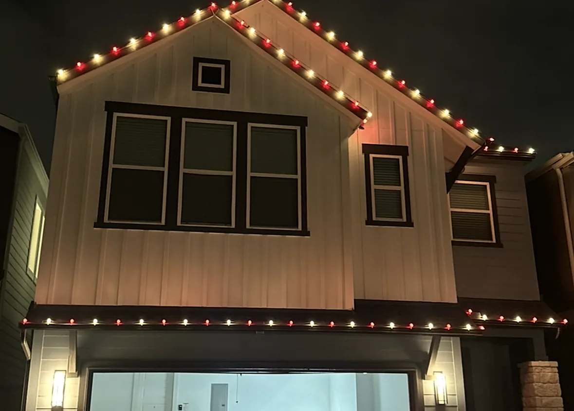 Event & Wedding Lighting in Houston: steep gable outlined in red and warm white C9 bulbs